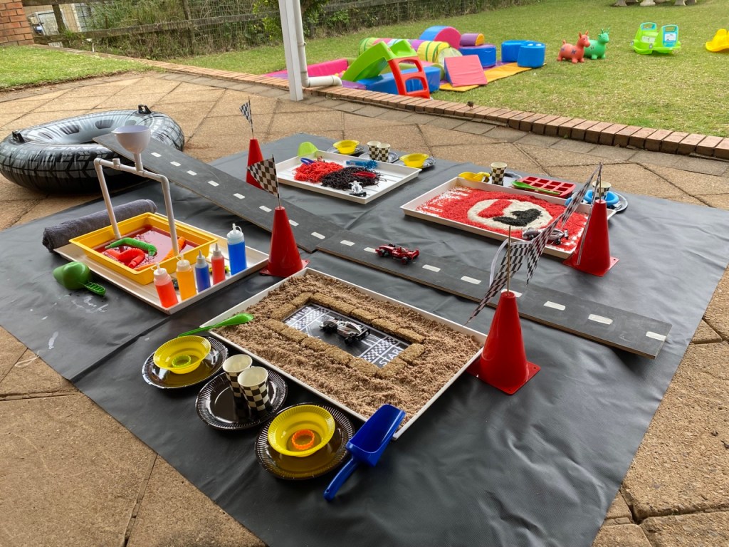 Formula one themed messy play and small soft play set for hire 